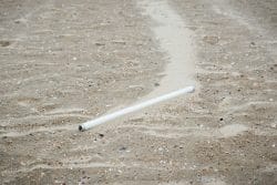 Fluorescent light tube in the sand