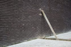 Brick wall, wooden beam and pavers