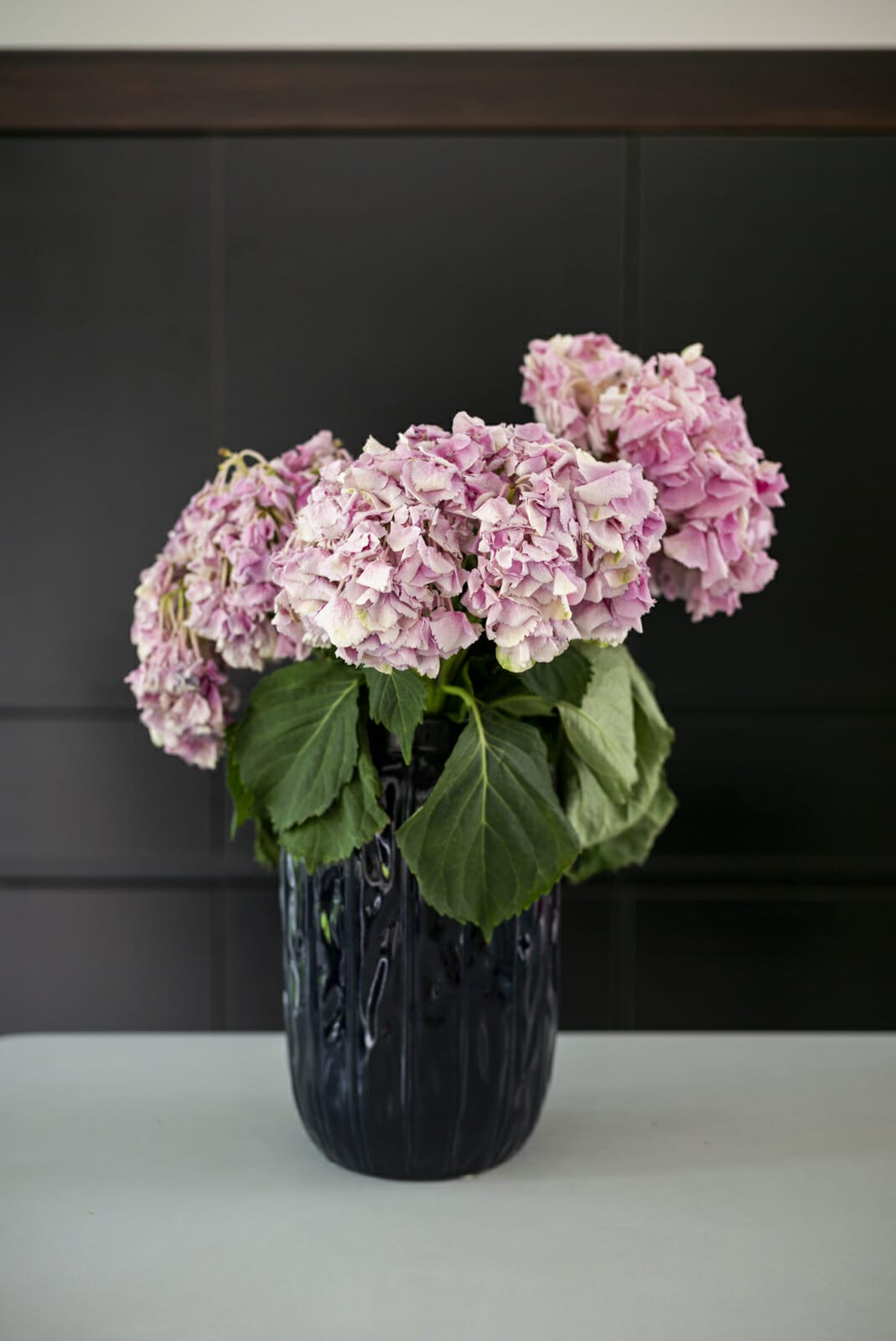 Pink hydrangeas in blue vase